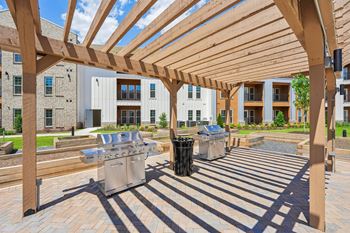 Resort style pool with sun deck & grill area